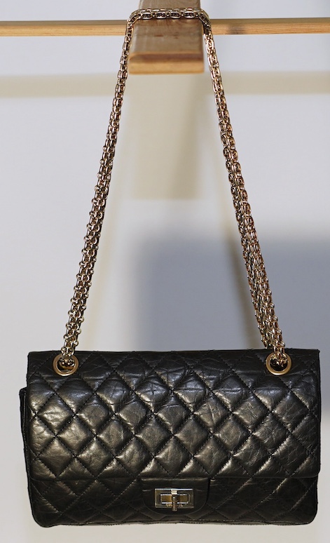 A Chanel 2.55 black leather handbag